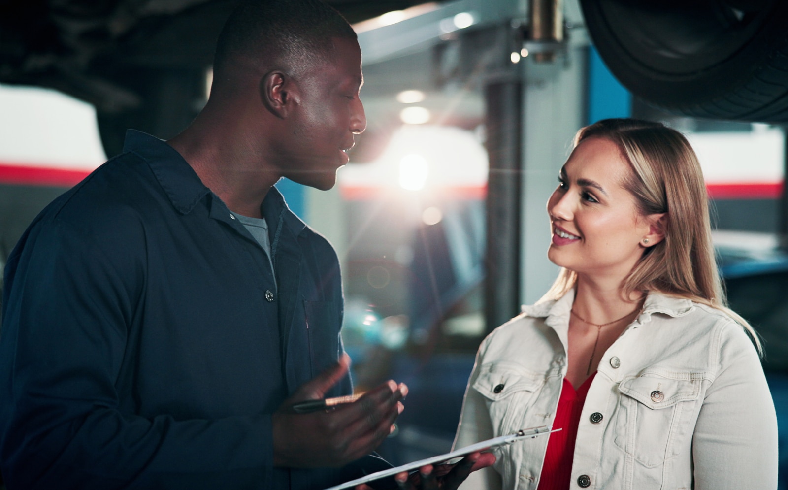 Mechanic advising a customer at the workshop