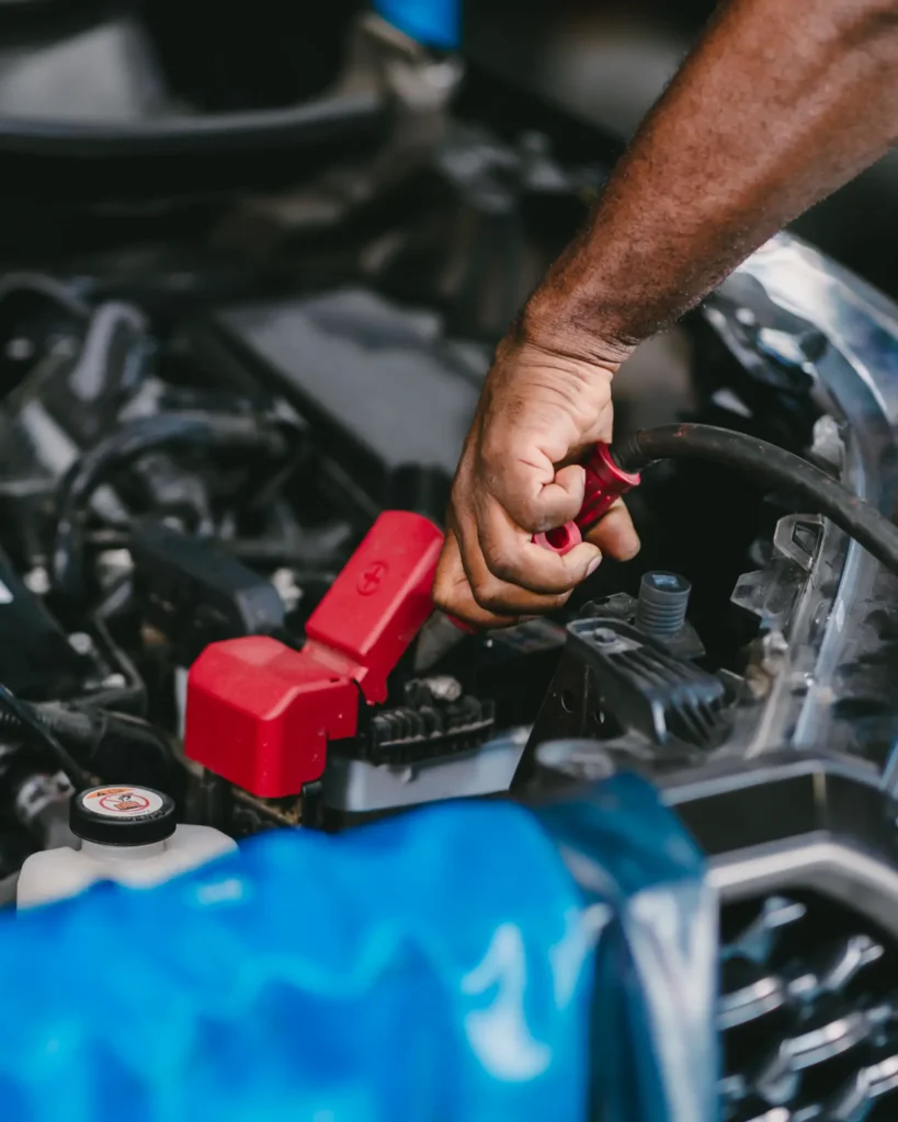 mechanic is fixing auto electricals issue.